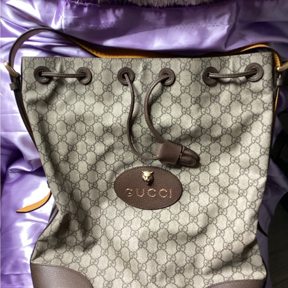 Gucci supreme monogram bucket backpack